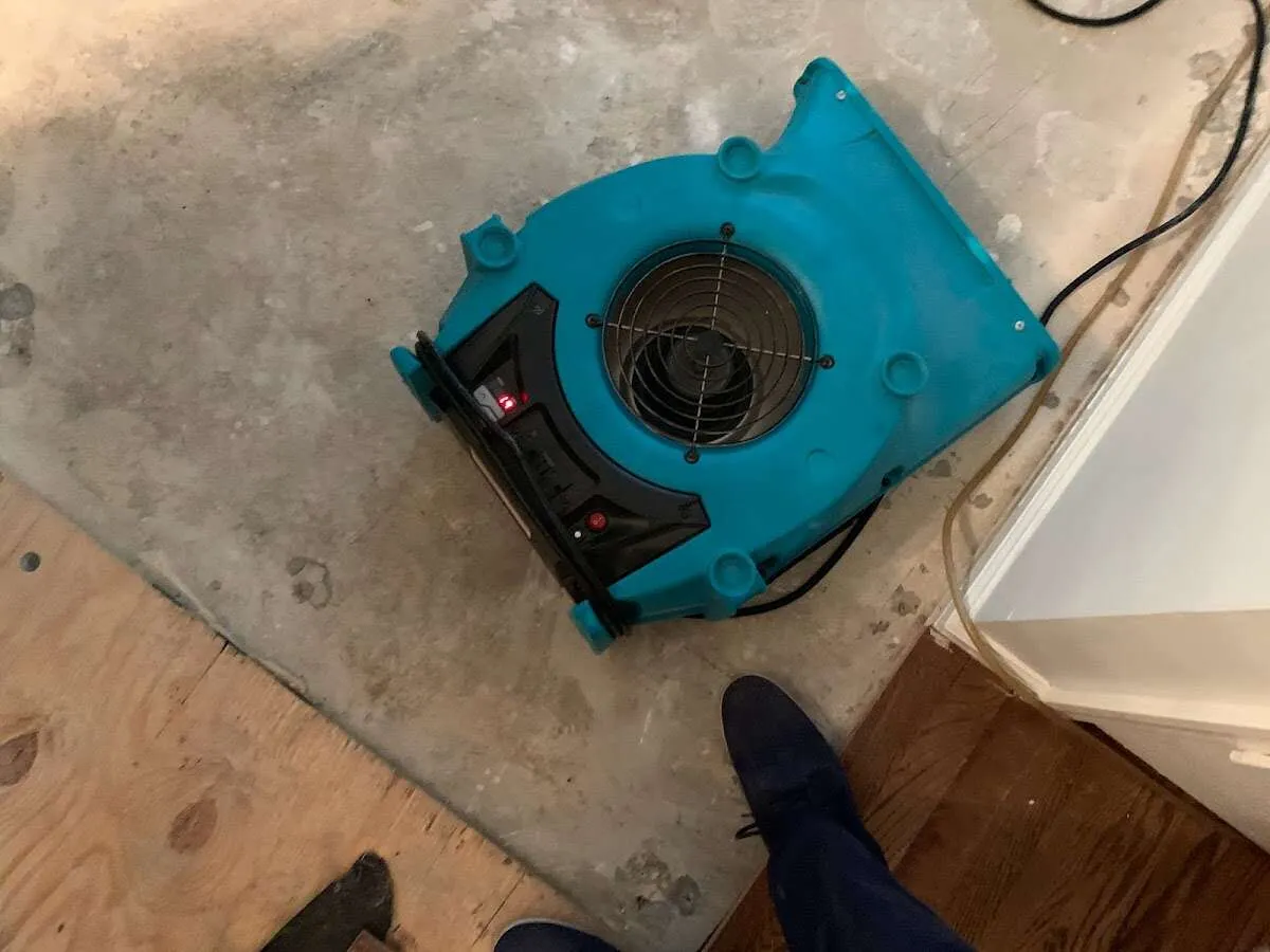 Air mover drying subfloor during Leak Detection & Repair in Hood River